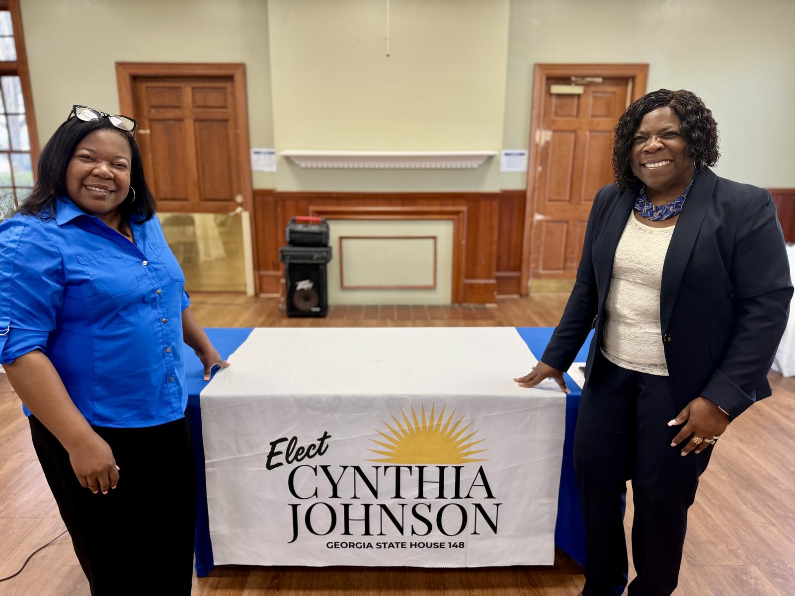 Cynthia Johnson greeting supporters at a campaign event