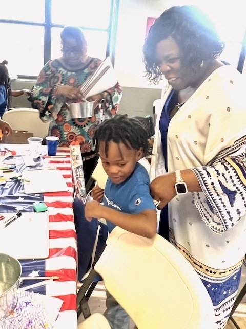 Cynthia Johnson with a young supporter at a community event